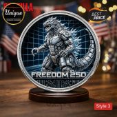 Silver futuristic Godzilla robot coin with blue grid background. Features text FREEDOM 250! Kaiju fan collectible!