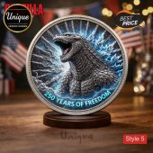 Grayscale Godzilla roaring on a silver commemorative coin with blue lightning and '250 YEARS OF FREEDOM' text!