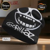 Black beanie featuring a white Gorillaz face and the band's name embroidered on the brim.!