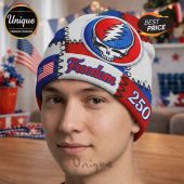 Beanie hat with patchwork design: Grateful Dead skull, USA flag, 'Freedom' text, & '250' number for patriotic style.!