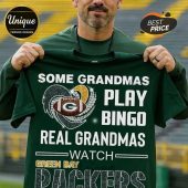 Green tee with 'Some Grandmas Play Bingo, Real Grandmas Watch Green Bay Packers' text and football graphic!
