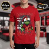 Red tee features green Grinch-like character in Santa hat and Man Utd jersey, holding ball! Text: THEY HATE US BECAUSE THEY ain't US MANUTD!