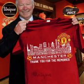 Red Manchester United legends t-shirt, skyline graphic with player names like Giggs, Charlton, Best, Law, Ferguson.