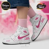 White high-top sneakers with pink swoosh, custom text 'Megan Moroney,' 'Cloud 9,' and name. Street style!