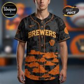 Gray baseball jersey with an all-over anime design, orange Brewers text, and cloud graphics.!