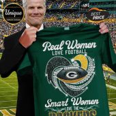 Green tee: Real Women LOVE FOOTBALL, Smart Women LOVE THE PACKERS text with football & hearts graphic!