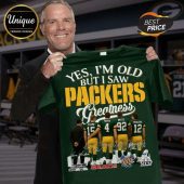 Green tee with Favre holding. Text: YES I'M OLD BUT I SAW PACKERS Greatness with player images below!