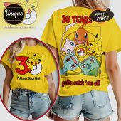 Yellow tee with Pokémon '30 Years' design! Pikachu, Charmander, Mew, Squirtle, Bulbasaur art. 'Gotta Catch 'Em All' text!