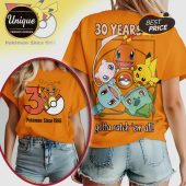 Orange Pokemon shirt with Charmander, Pikachu, Mew, Bulbasaur, Squirtle, plus text '30 Years' and 'Gotta Catch 'em All'!