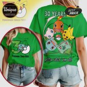 Green 30 Years tee! Pokemon Since 1996 text. Pikachu, Charmander, Bulbasaur & Squirtle graphics. Gotta catch 'em all!