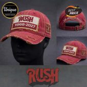 Distressed red baseball cap with RUSH 1968-2027 patch, yellow star logo, and 'THE SPIRIT OF RADIO' on back!