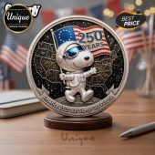 Silver coin features Snoopy in a spacesuit with a US flag, text 
