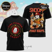 Black tee with Snoopy firefighter design! Features 'Fire Dept', 'Snoopy' text, plus axes and classic logo art!