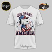 White tee, cartoon style, Snoopy. Text: GOD BLESS AMERICA, blue, red, stars. Patriotic design!