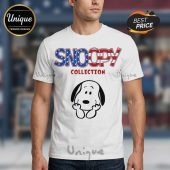 White tee with Snoopy graphic. Text: 'SNOOPY COLLECTION'. Blue stars, red stripes, cartoon dog print!