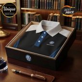 Volkswagen polo shirt in a display box with a fountain pen on a desk.!
