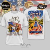 White tee with Wizard of Oz & patriotic theme. 'Wizard of Oz', 'Brains to Dream the Path', 'There's No Place Like Home', 'America 250th'.!