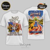 White tees: Wizard of Oz & patriotic themes! Text: WIZARD OF OZ, BRAINS TO DREAM THE PATH, There's No Place Like HOME, America 250th!