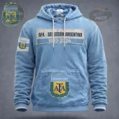 Light blue distressed hoodie with AFA Selección Argentina 1893-2026 text and AFA shield logos on chest and sleeve!