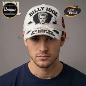 A white distressed Billy Idol baseball cap with his portrait and black text saying 'it's a nice day to... tour again'!