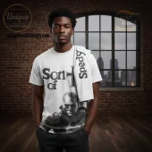 White graphic tee, bold black 'Son of' with crosses, halftone portrait. 'Speedy' on draped item!