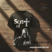 Black graphic tee, retro style, white 'Son of' text, bold cross symbol, halftone portrait of Daniel Caesar!