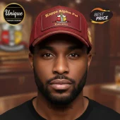 A crimson baseball cap with a leather patch featuring the Kappa Alpha Psi crest and text 'Est. 1911' in gold script!