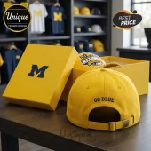 Yellow baseball cap with blue 'GO BLUE' text embroidered on the back! Adjustable strap with brass buckle for Michigan fans!