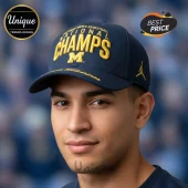 Navy blue Michigan Wolverines basketball cap with yellow embroidered text National Champs M and Jumpman logo on the side!