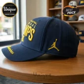 Navy blue Michigan Wolverines hat with yellow 3D embroidered text BASKETBALL NATIONAL CHAMPS and a yellow Jordan Jumpman logo!