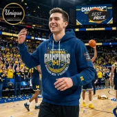 Blue hoodie with NCAA Men's National Champions Michigan Men's Basketball 2026 text in a gold and white graphic!