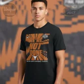 Black tee with orange pixelated 'WE'RE NOT DONE' text, Nike swoosh, 'FINAL FOUR' logo, white longhorn, '2026 FORT WORTH REGIONAL CHAMPS'!