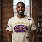 Cream distressed tee with purple and gold Omega Psi Phi ΩΨΦ 1911-2026 text and ripped details!