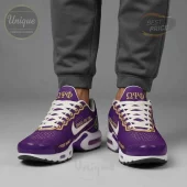 Custom purple gold white athletic shoes with ΩΨΦ, Omega Psi Phi, and YOUR NAME text details on white soles!