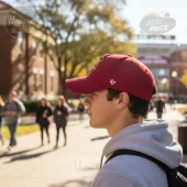 Maroon textured baseball cap with an indistinct dark front logo and a clear white '47' logo on the side! Classic campus style!