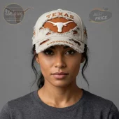 Distressed khaki baseball cap with burnt orange 'TEXAS' and white Longhorn logo! Under brim features 'LONGHORNS' text!
