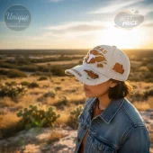 Distressed beige baseball cap with orange Texas Longhorns text and longhorn skull logo, featuring torn fabric and frayed brim!