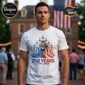 White t-shirt with American flag graphic, cartoon pilot beaver, fighter jets, and 250 YEARS 1776-2026 text.!