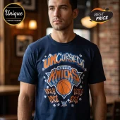 Navy blue t-shirt with orange and white New York Knicks basketball graphic and Uncursed Very Nice Very Evil text!