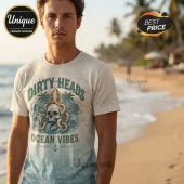 Cream t-shirt with vintage style Dirty Heads Ocean Vibes text skull octopus design and anchor graphic on beach background!