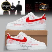 White sneakers with red Nike swoosh featuring Eslabon Armado text, Amor Nocturno, signatures, and custom name space!