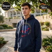 Navy blue FC Barcelona pullover hoodie with gold circular text El Nostre Cami Present I Futur and red star accents!