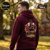 Maroon hoodie with back print of a female soccer team and trophy with text Glorious Hearts Champions 2025-26!
