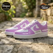 Custom lavender and white sneakers with the text Freedom and Kesha printed on the side leather panels!