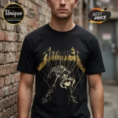 Black Metallica t-shirt with distressed yellow metallic skull print graphic and puppet strings design on a male model!