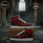 High top sneakers with red and black graffiti pattern featuring crown symbols and white laces on a cardboard box!