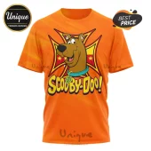 Orange t-shirt featuring Scooby-Doo cartoon head with a yellow and red cross icon and Scooby-Doo text!