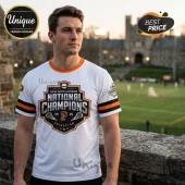 White Princeton lacrosse tee with orange black trim featuring 2026 National Champions graphic and NCAA logo!