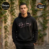 Black hoodie with pink Rita Ora signature text and heart graphic on front worn by a male model!