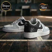 Custom black, white, and grey sneakers featuring a basketball team logo and customizable Your Name text on a court floor!